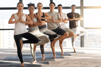 vrksasana yoga group of happy multiethnic people 2022 12 16 06 40 39 utc